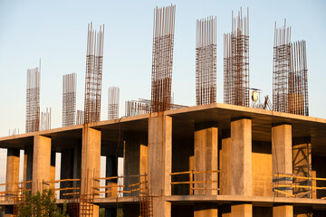 tower cranes at construction site and city background
