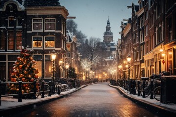  a snowy street with a lit christmas tree in the middle of the street and buildings on both sides of the street.