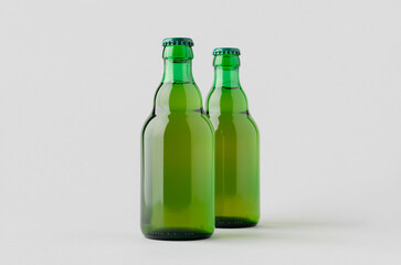 Green steinie beer bottle mockup on a grey background.