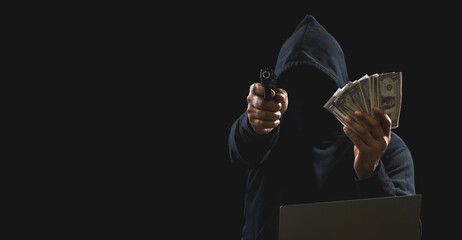 Portrait killer hacker gangster spy man one person in black hoodie standing look hand holding gun money dollar obtained from robbery threats crime attack victim people night dark background copy space - obrazy, fototapety, plakaty