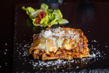 lasagna on black slate