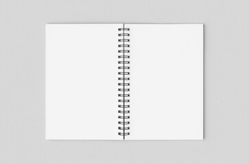 Blank white inside of a black spiral notebook mockup.