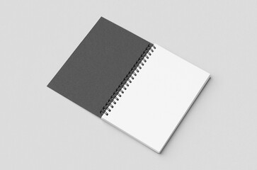 Black spiral notebook mockup with blank white inside.