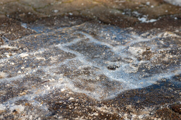 an icy stone footpath in winter