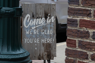 Come in we're glad you're here sign