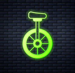 Glowing neon Unicycle or one wheel bicycle icon isolated on brick wall background. Monowheel bicycle. Vector © Iryna