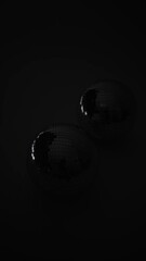 Glowing mirror balls on a black background