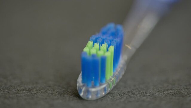 HDR 4k video toothbrush spinning closeup on bristles