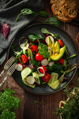 Plate with salad with fresh vegetables 