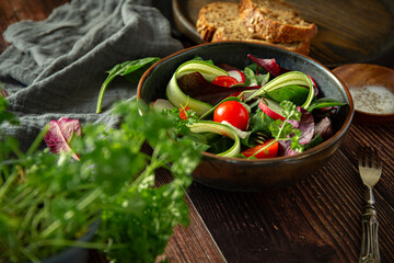 Plate with salad with fresh vegetables 