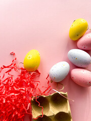 Happy Easter Concept. Easter eggs on pastel pink background. Postcard. Simple minimalism flat layer top view copy space