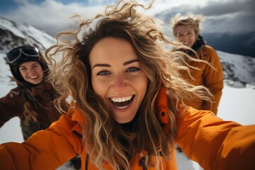 Group of young female tourists taking selfie against the backdrop of snowy mountain tops. Cheerful diverse girls in winter outwear spend vacation together hiking and skiing.