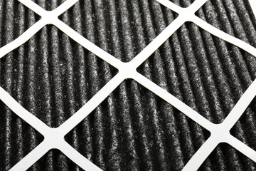 HVAC filter with carbon material for foul odors