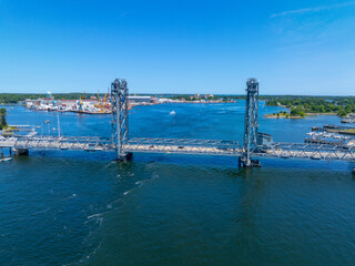 Obraz premium World War I Memorial Bridge aeria view. The bridge carries US Route 1 across the Piscataqua River between Portsmouth, New Hampshire and Kittery, Maine, USA. 