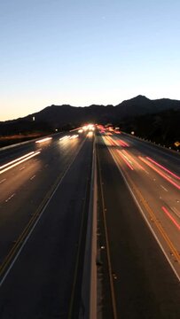 Vertical time lapse view of night traffic on the 118 freeway in the Chatsworth area of Los Angeles California.