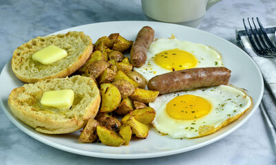 fried eggs with sausage and home fries