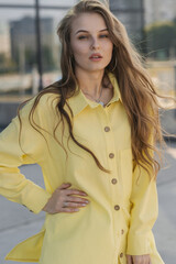 cute female in a yellow summer outfit.