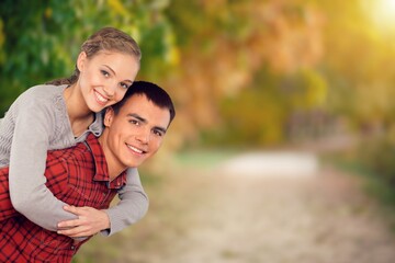 Naklejka premium Happy young cute couple have fun outdoors