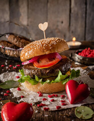 delicious hearth shaped cheesburger with fresh meat cheese and salad, valentins day promo for...