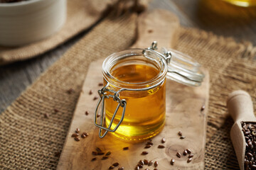 A glass jar of flax seed oil