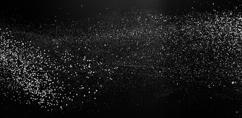 Freezing falling particles or stardust in air on black background for overlay blending mode. Stopping the movement of white powder on a dark background, selective focus, wide banner - obrazy, fototapety, plakaty