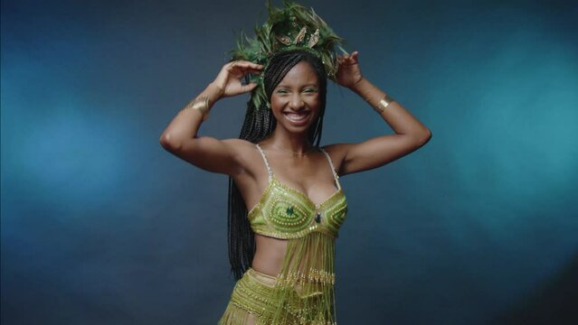 Brazilian woman in green carnival clothes, dancing 