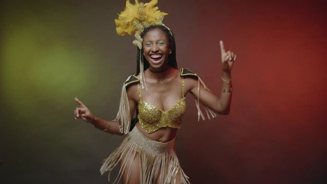 Brazilian woman in golden carnival clothes, dancing.