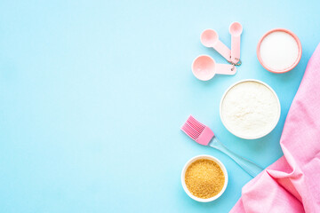 Food baking background. Ingredients for cooking at blue. Flat lay.