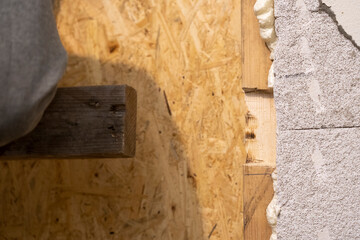 Placing Wooden Plank into Newly Made Notch with Skillful Precision.