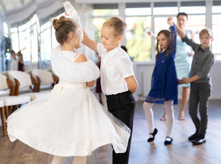 Classical dances performed by preteen children in beautiful festive clothes