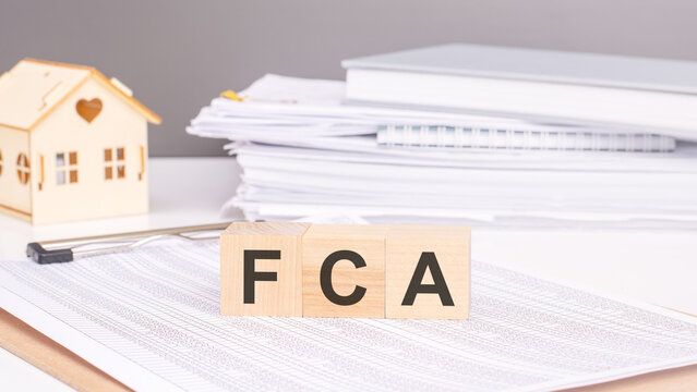 FCA - business and technology concept. text on wooden cubes