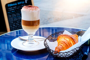French breakfast. Cappuccino with croissant
