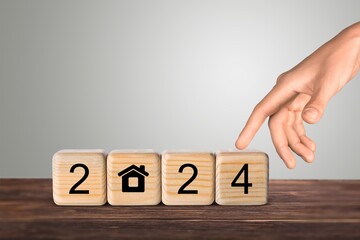 Happy 2024 New Year with Home icon on wooden cubes