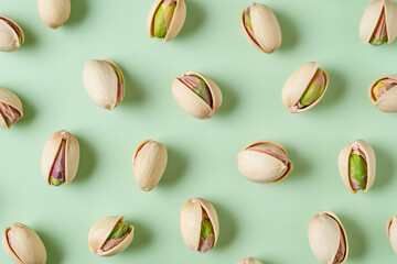 pistachio top view pattern on light pastel green background