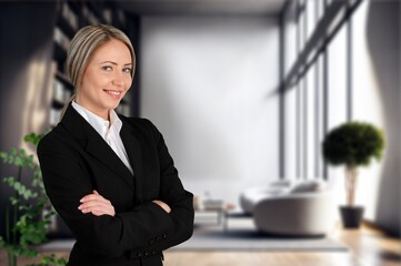 Happy professional business woman standing in office