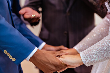 a wedding couple holding hands