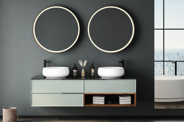 Modern bathroom interior with concrete floor, white oval bathtub and two sinks, front view. Minimalist bathroom with modern furniture and city view.