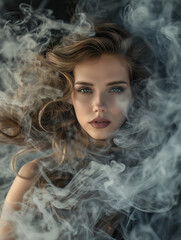 Woman's face partially obscuring by flowing smoke