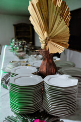 a buffet table with white porcelain plates