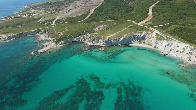 Alacati Halk beach. Turquoise sea and rocky beach. Bird eye view of Delikli Koy beach in Alachati, Turkiye