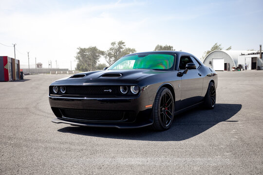 car driving on the road black Dodge Challenger SRT Hellcat detail