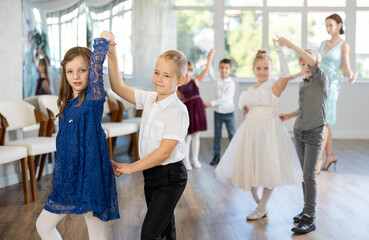 Classical dances performed by preteen children in beautiful festive clothes