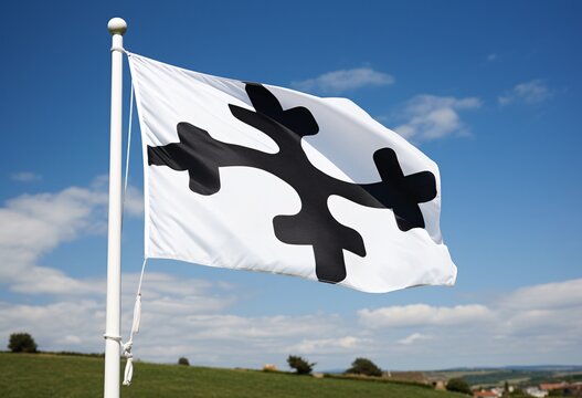 A white and black flag with a cross design flies in the sky Generative AI