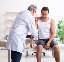 Young male patient visiting experienced doctor