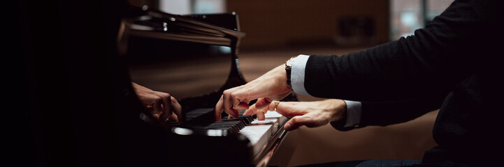 Hands in elegant suit playing pisano