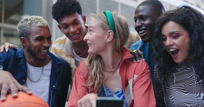Cellphone, conversation and group of friends in city networking on social media, mobile app or the internet. Happy, diversity and young people scroll on a phone together in urban town for basketball.