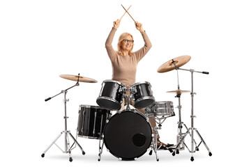 Woman playing drums isolated on white background