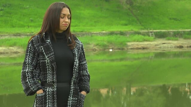 Young Cuban Woman's Solitude and Sadness in Park