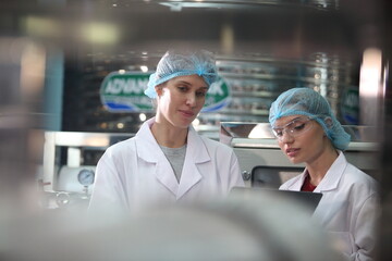 Team worker produces drinking water in a clean drinking water plant. drinking water production line