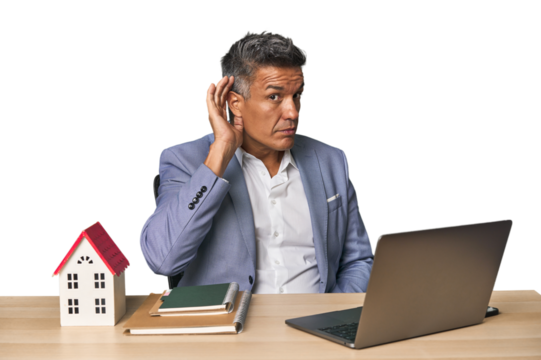 Middle-aged Hispanic businessman with real estate theme trying to listening a gossip.